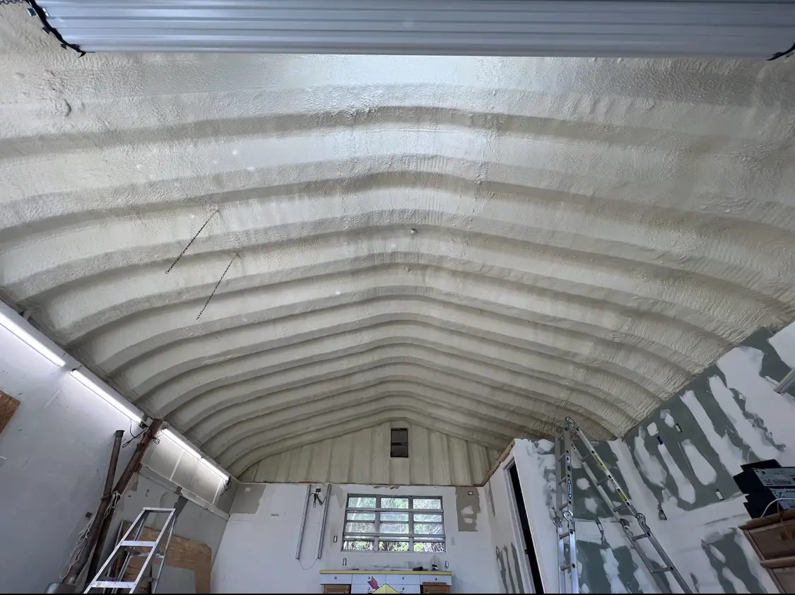 Spray polyurethane foam applied to the underside of a metal roof deck in Petaluma